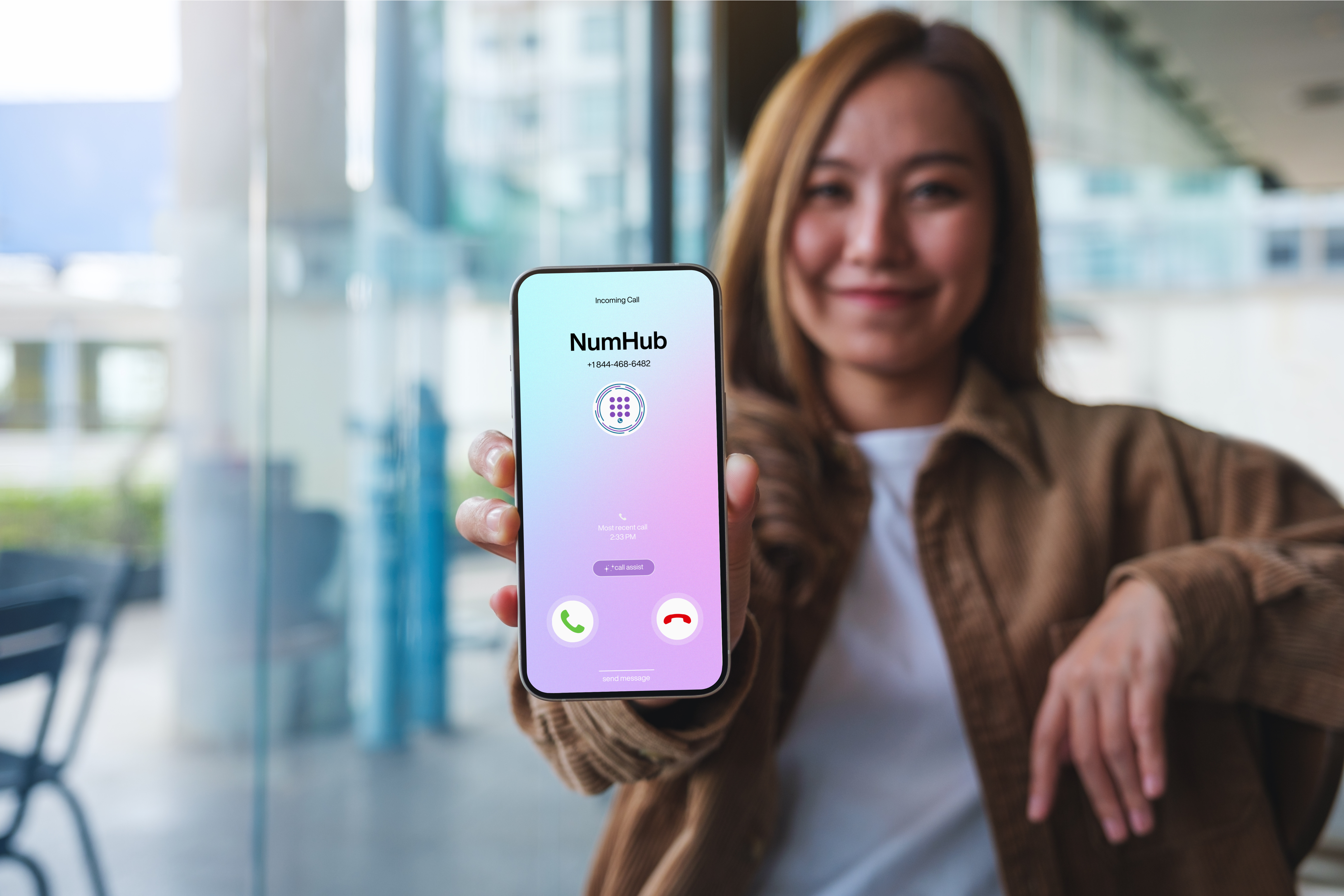 woman holding out phone displaying branded calling