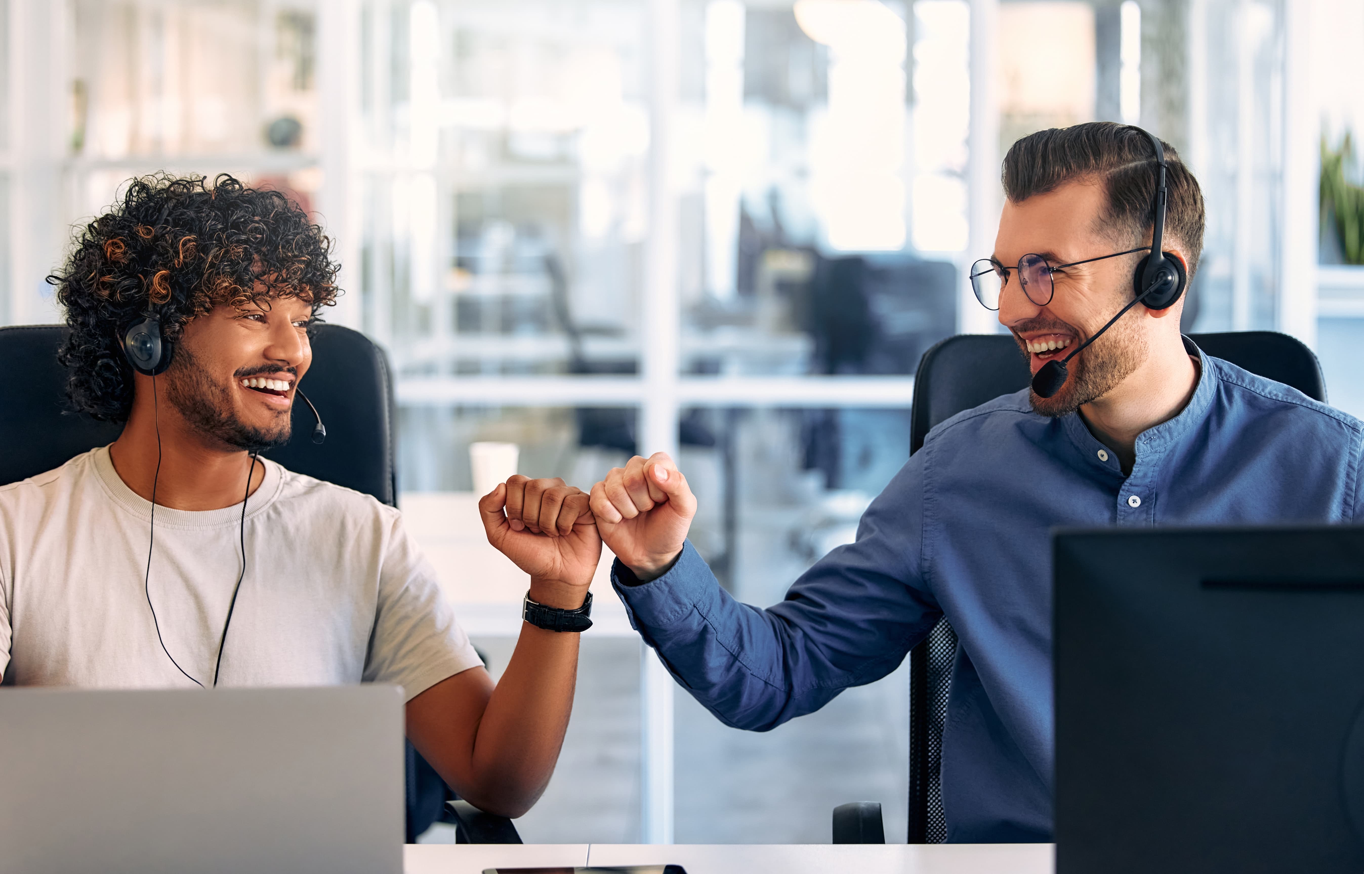customer service fist bumping over successful outbound calls